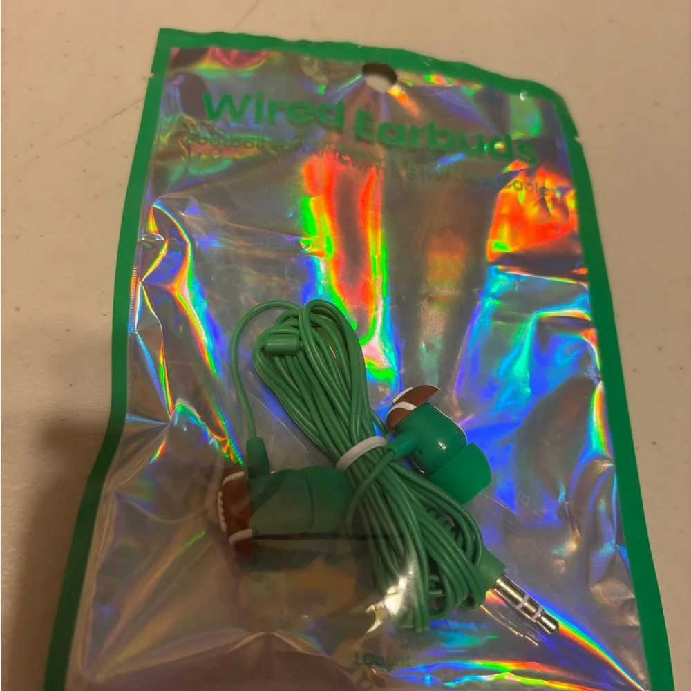 Green Wired Earbuds plug ins. Green with football on ends. New no tags